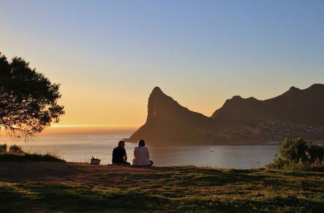 The sunset scene, in addition to objects, is characterized by a greater variety of colors, shades, and luminance.